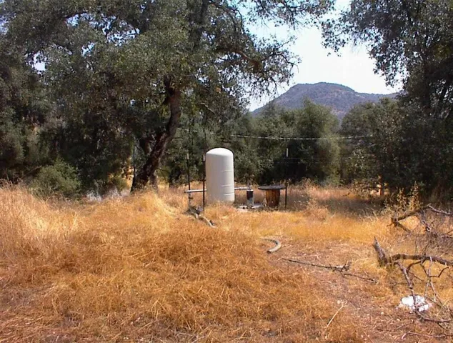 a backyard of a house with mountain view and a lake view