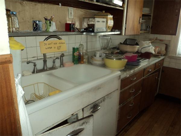 59 King Philip Road Worcester, MA 01606 - Photo 16 of 20 a kitchen with a sink and cabinets