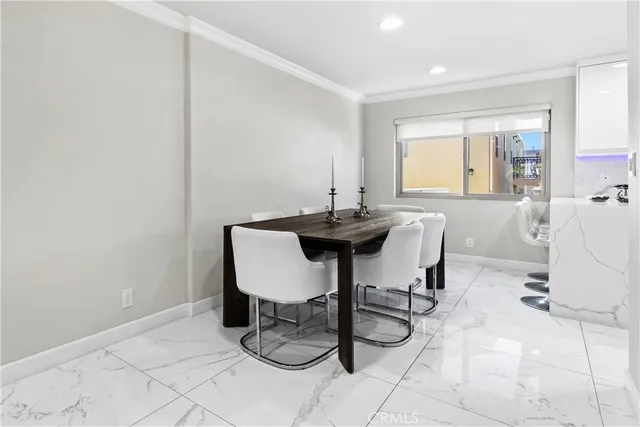 a kitchen with stainless steel appliances kitchen island granite countertop a refrigerator and a stove top oven