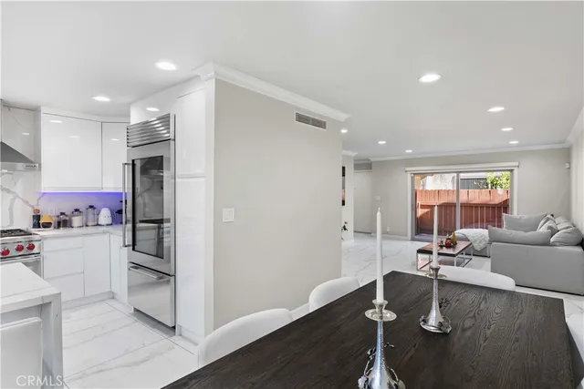 a kitchen with stove and cabinets