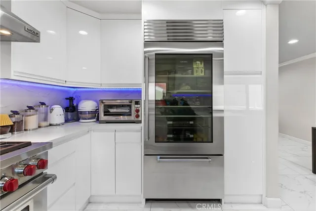 a view with a sink and chairs