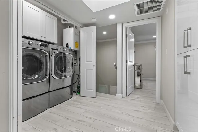 a bedroom with a bed and a large mirror