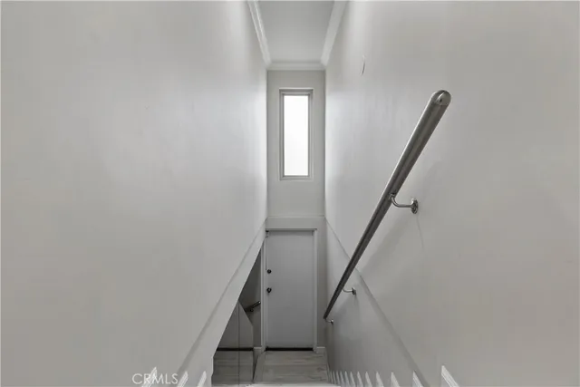 a view of entryway and hall with a front door