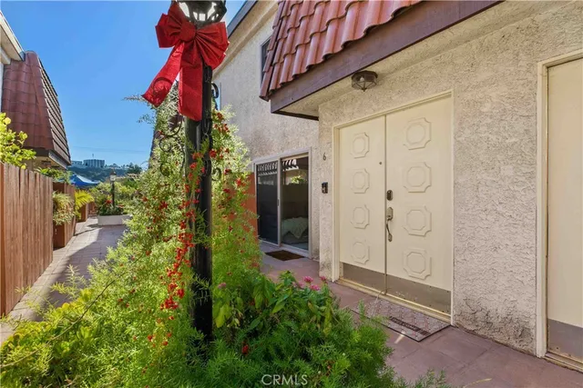a view of a house with a small yard
