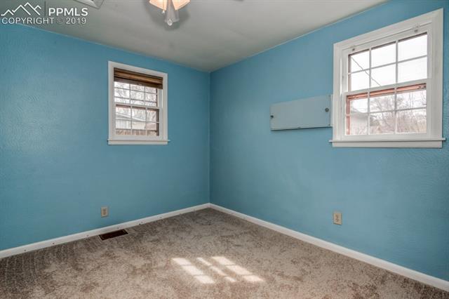 611 Prairie Road Colorado Springs, CO 80909 - Photo 10 of 18 Brand new carpet and padding installed.