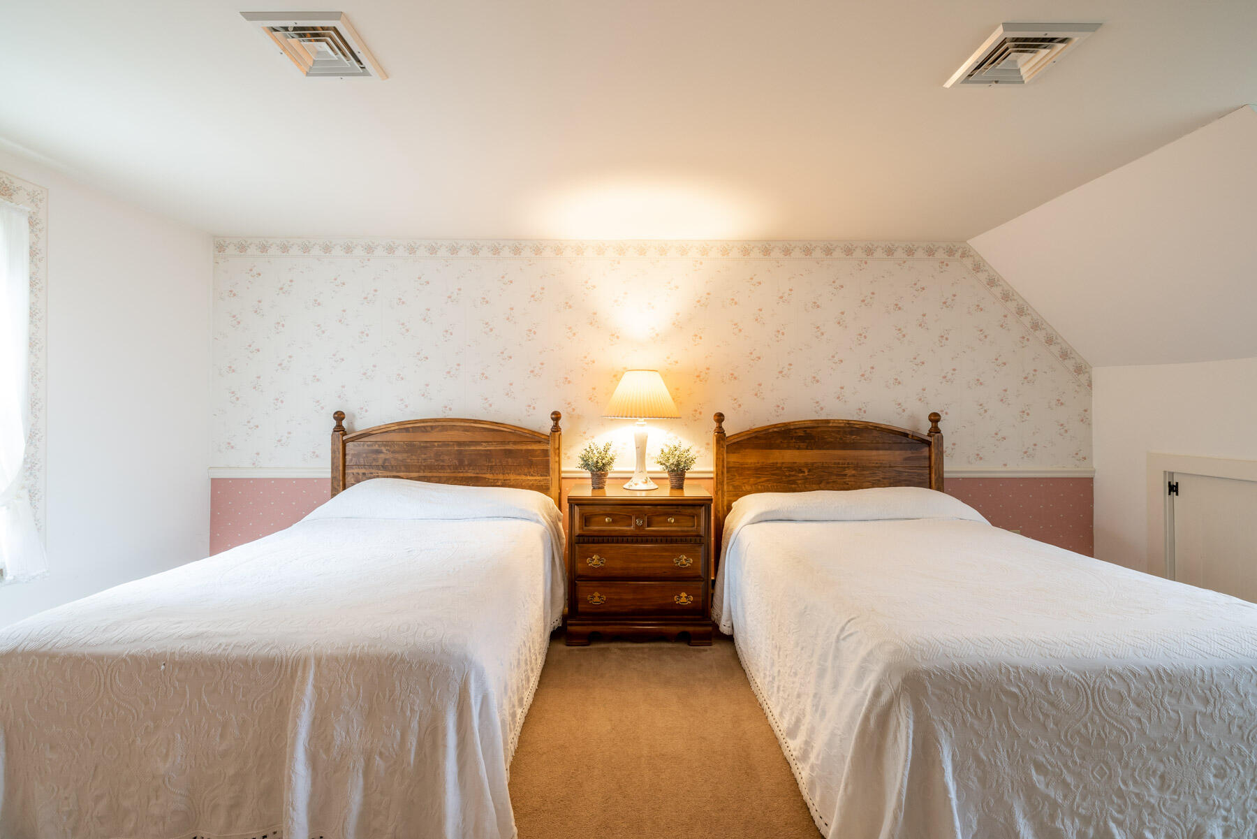 68 Marthas Road Edgartown, MA 02539 - Photo 12 of 20 a bedroom with bed and a night stand