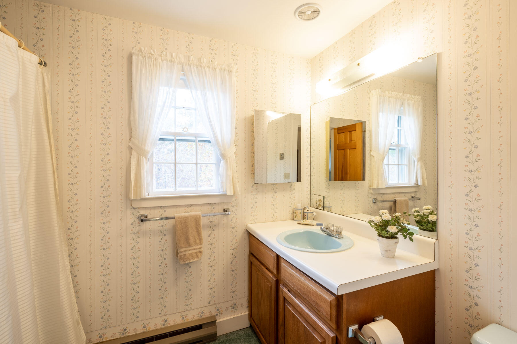 68 Marthas Road Edgartown, MA 02539 - Photo 13 of 20 a bathroom with a sink a mirror and a shower