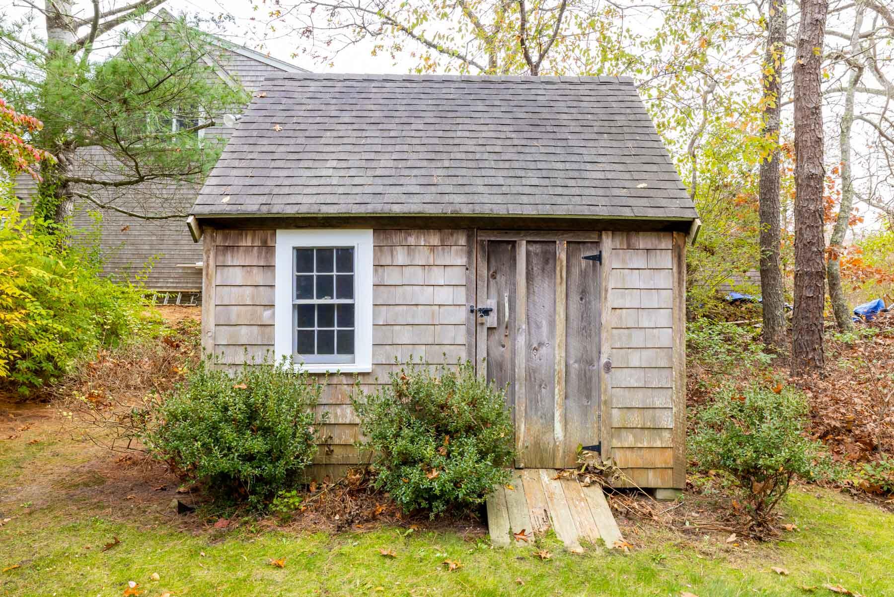 68 Marthas Road Edgartown, MA 02539 - Photo 17 of 20 a front view of a house with garden