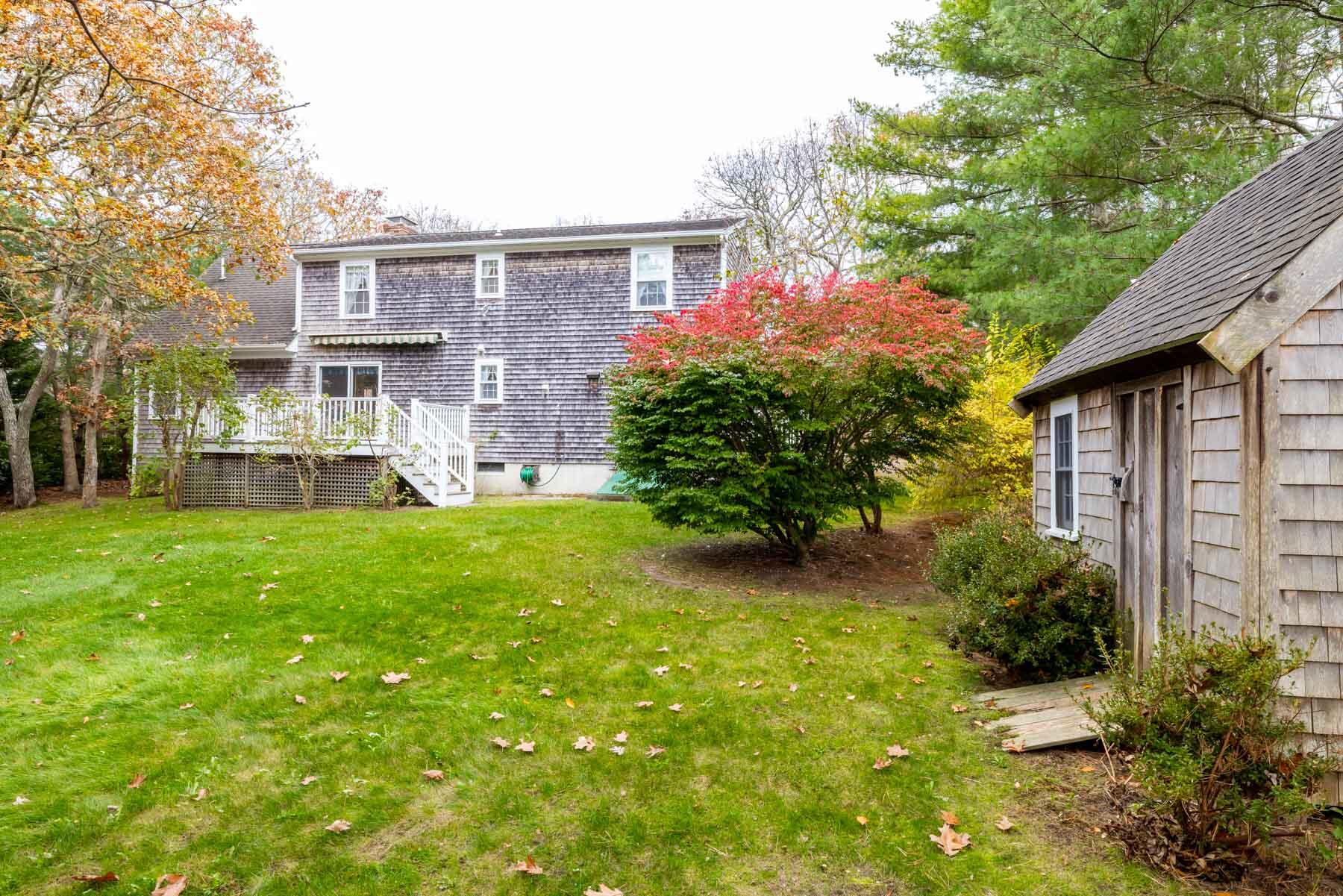 68 Marthas Road Edgartown, MA 02539 - Photo 18 of 20 a front view of a house with garden
