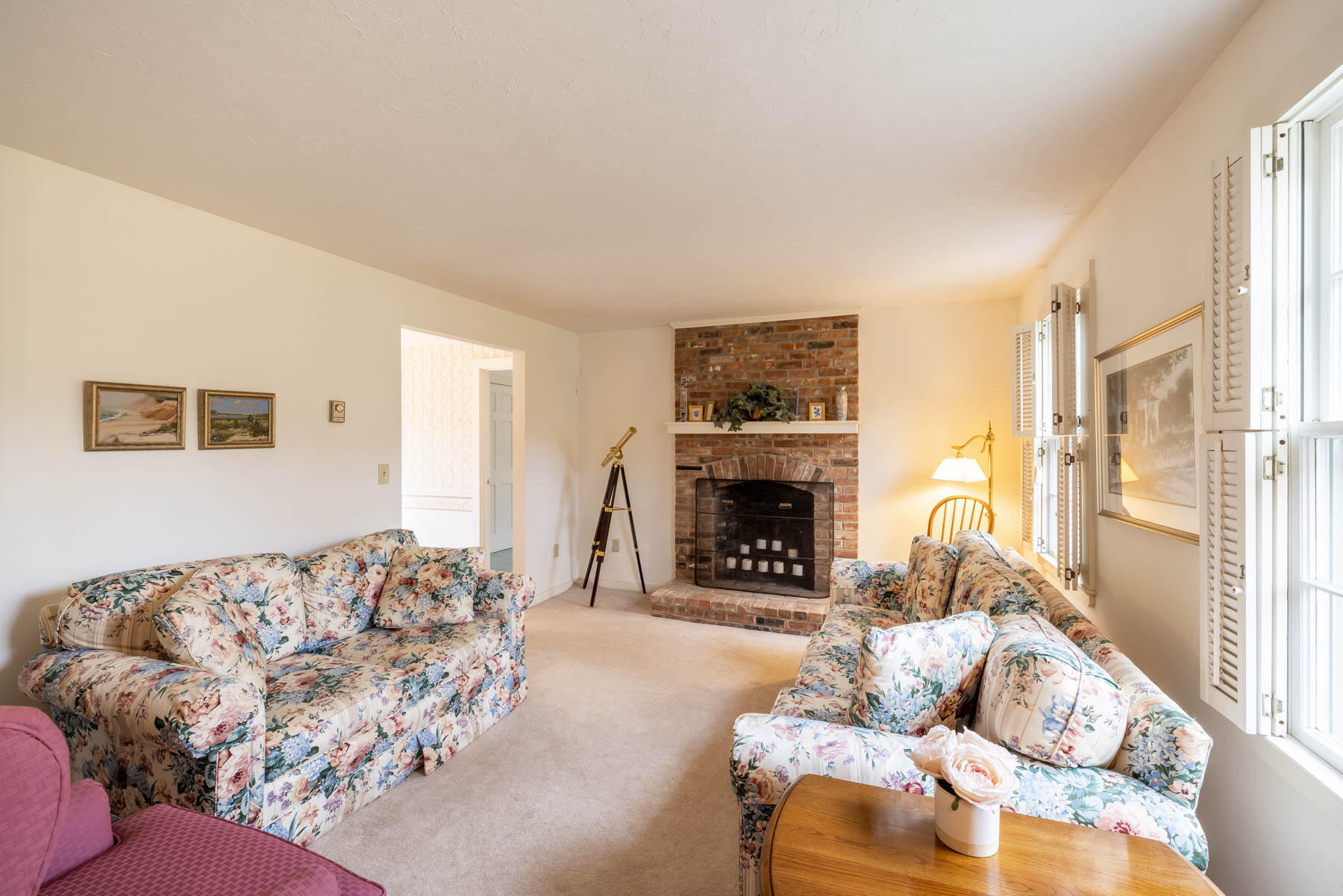 68 Marthas Road Edgartown, MA 02539 - Photo 2 of 20 a living room with furniture and a fireplace