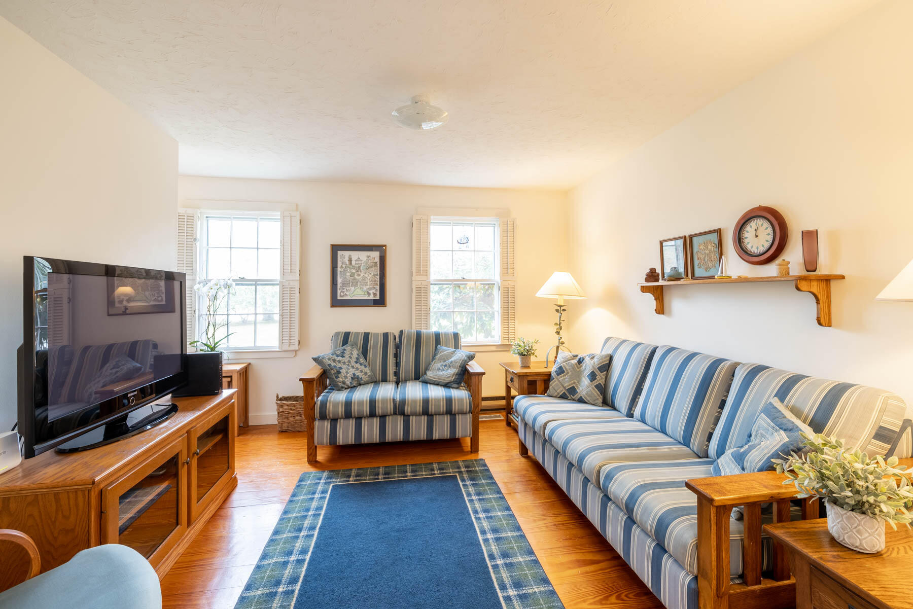 68 Marthas Road Edgartown, MA 02539 - Photo 5 of 20 a living room with furniture and a flat screen tv