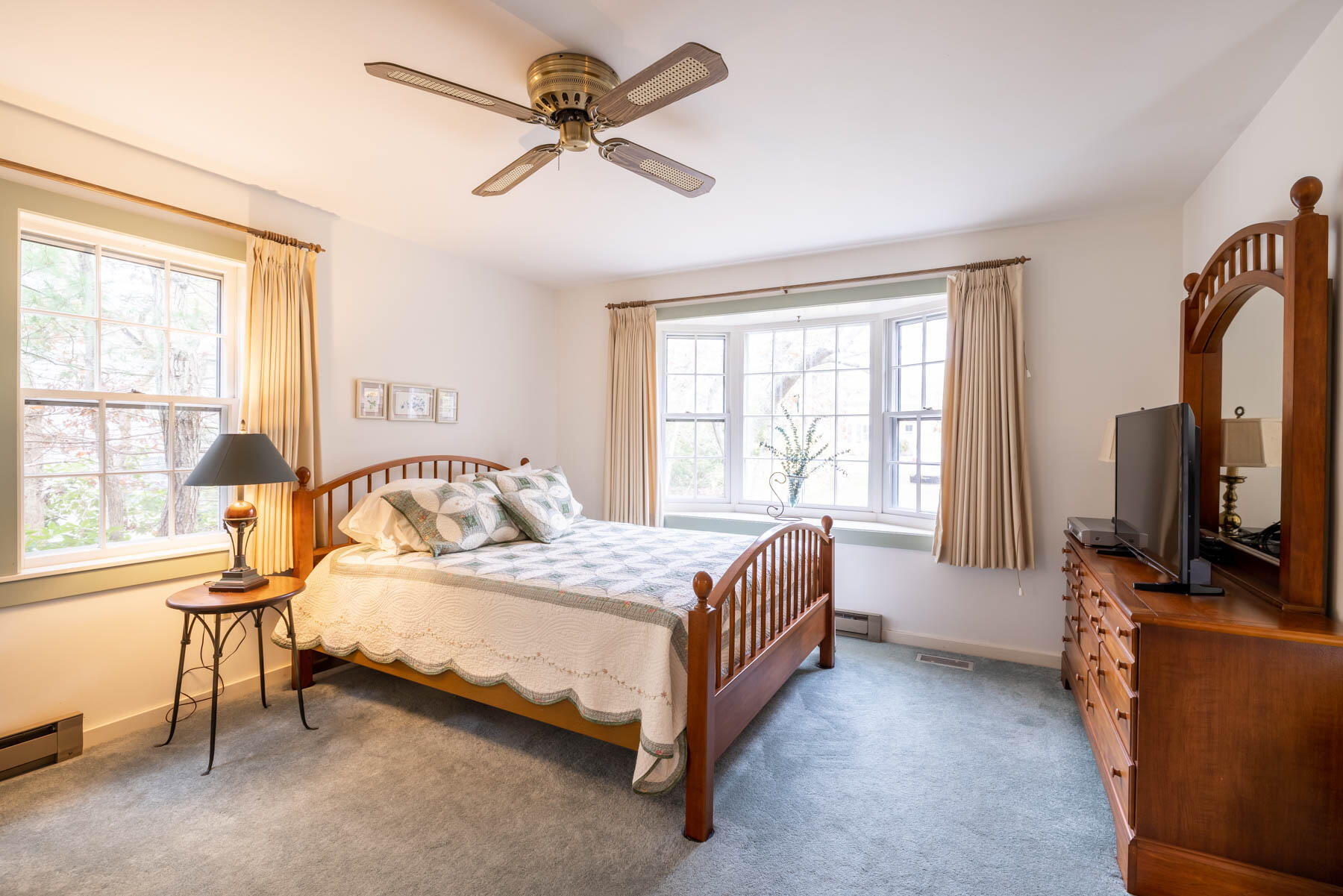 68 Marthas Road Edgartown, MA 02539 - Photo 6 of 20 a bedroom with a bed couch tv and a window