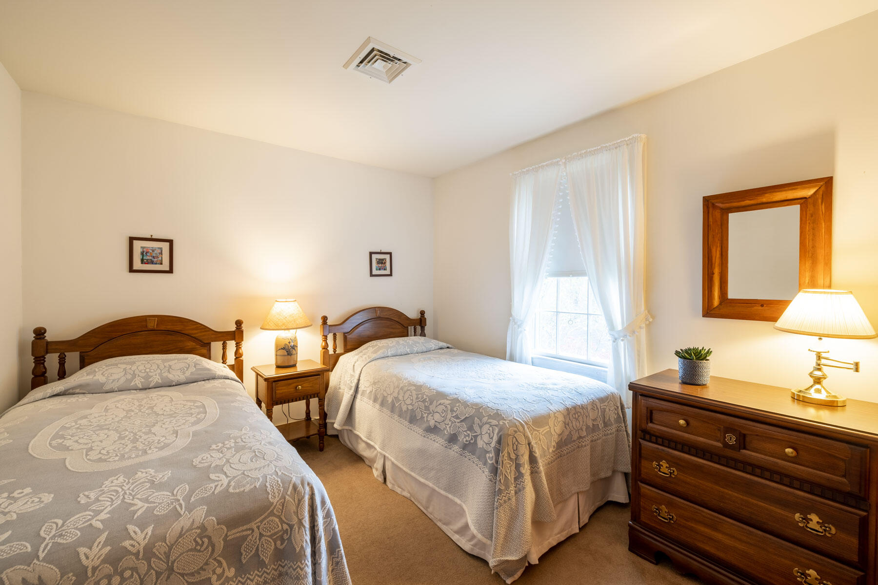 68 Marthas Road Edgartown, MA 02539 - Photo 10 of 20 a bedroom with two beds and lamps