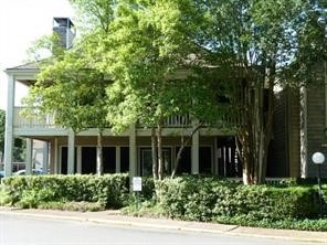 2100 Tanglewilde Street, Unit 124 Houston, TX 77063 - Photo 14 of 20 front view of a house with a yard
