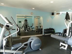 2100 Tanglewilde Street, Unit 124 Houston, TX 77063 - Photo 17 of 20 a room with gym equipment and wooden floor