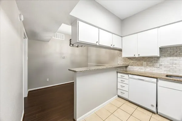 a kitchen with a refrigerator sink and stove