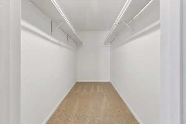 a bathroom with double vanity sinks and a mirror