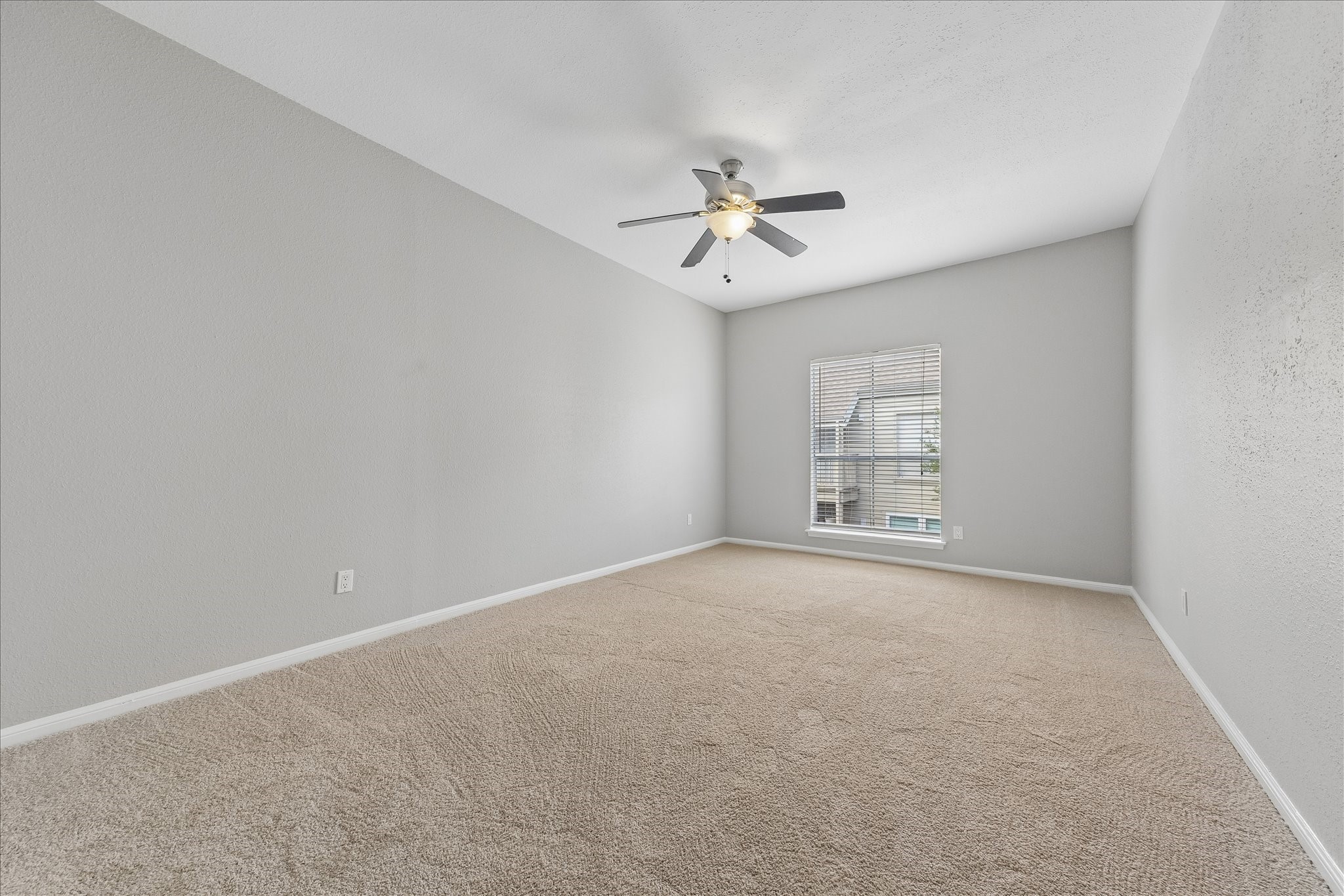 2100 Tanglewilde Street, Unit 124 Houston, TX 77063 - Photo 8 of 20 a view of a big room with windows and chandelier fan