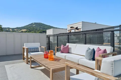 a view of a outdoor space with lounge chairs
