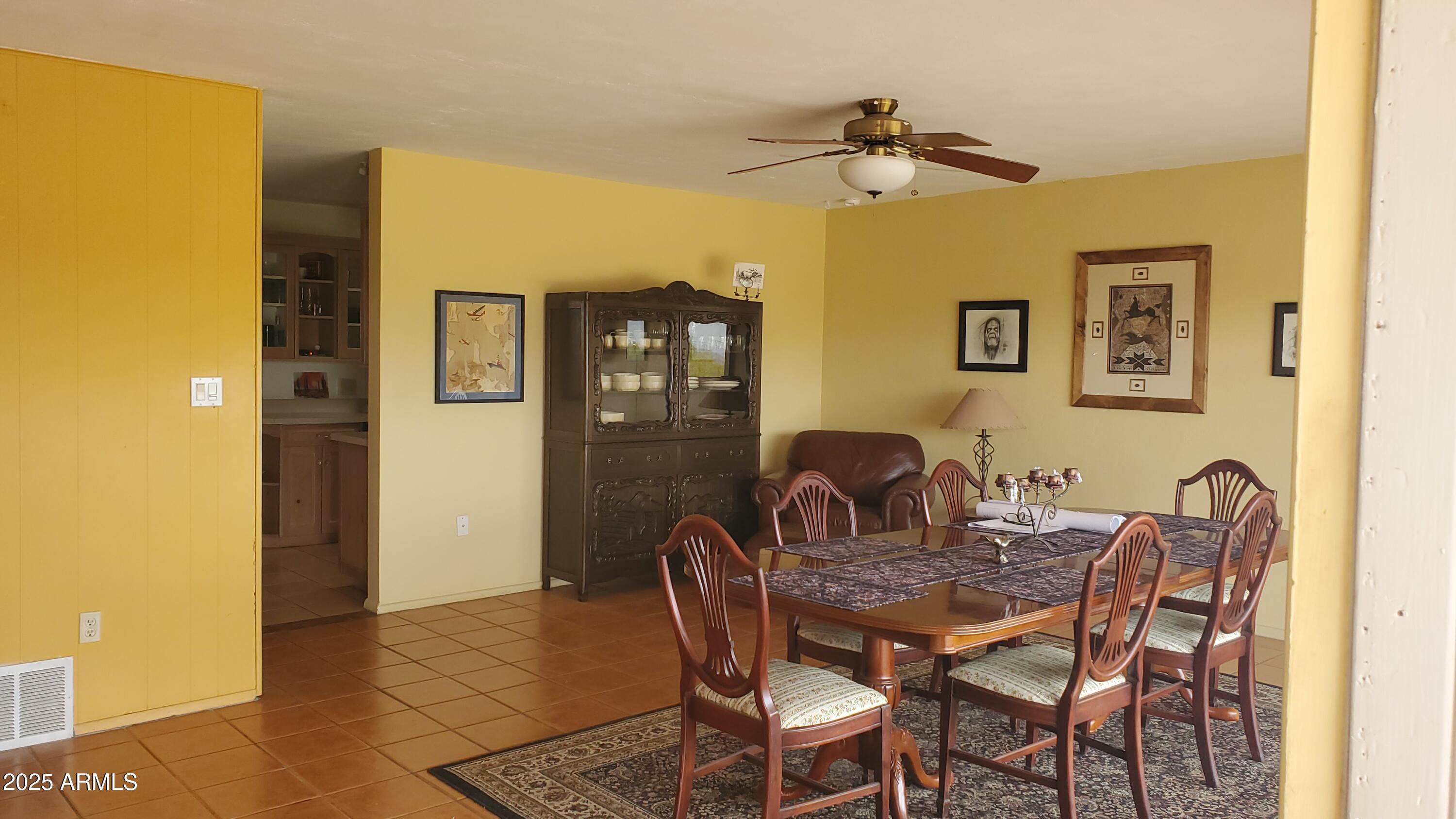 89 Pima Drive Bisbee, AZ 85603 - Photo 27 of 42 a dining room with furniture and a chandelier