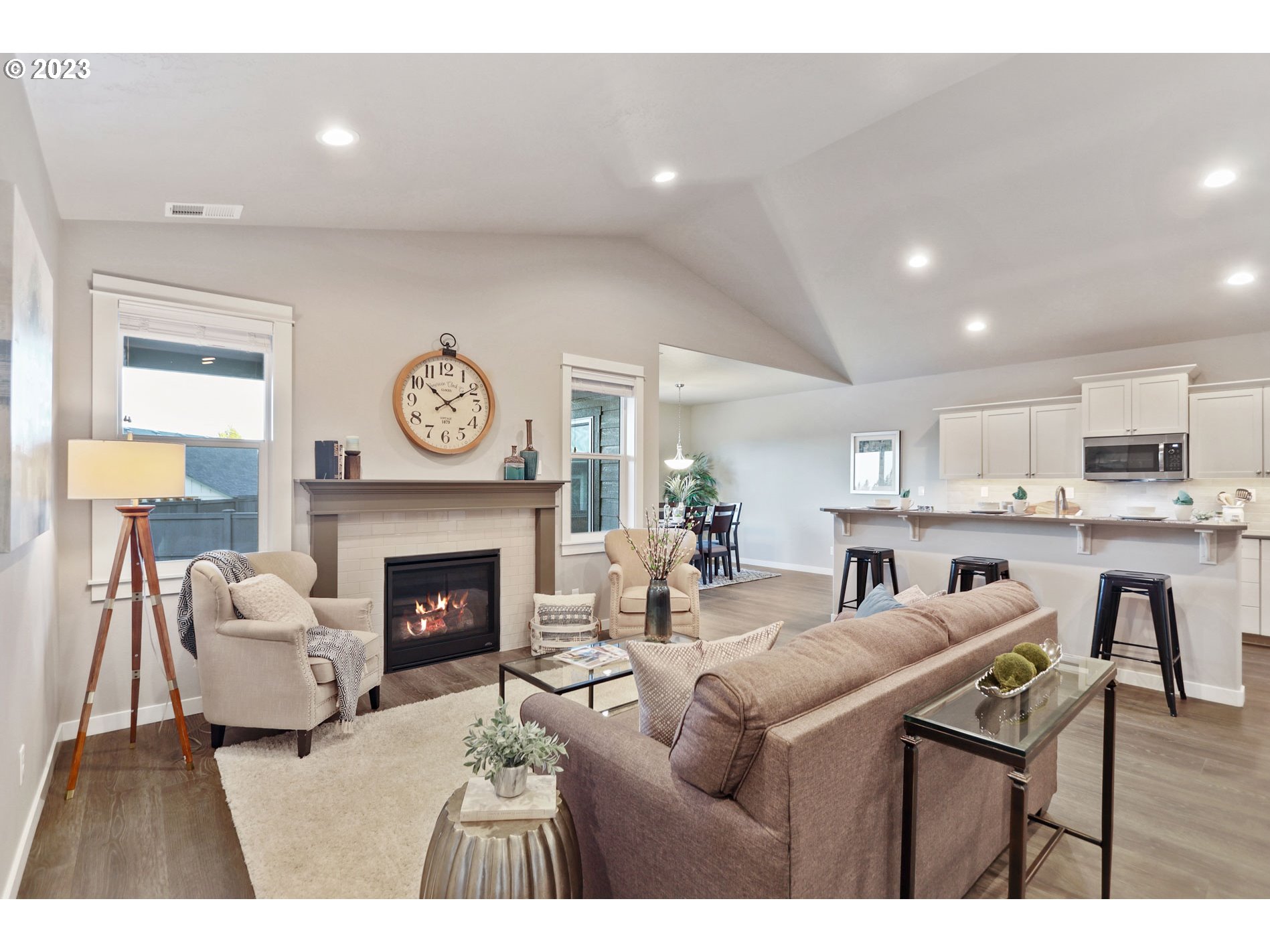 4961 Cedar View Drive Springfield, OR 97478 - Photo 7 of 12 a living room with furniture a fireplace and kitchen view