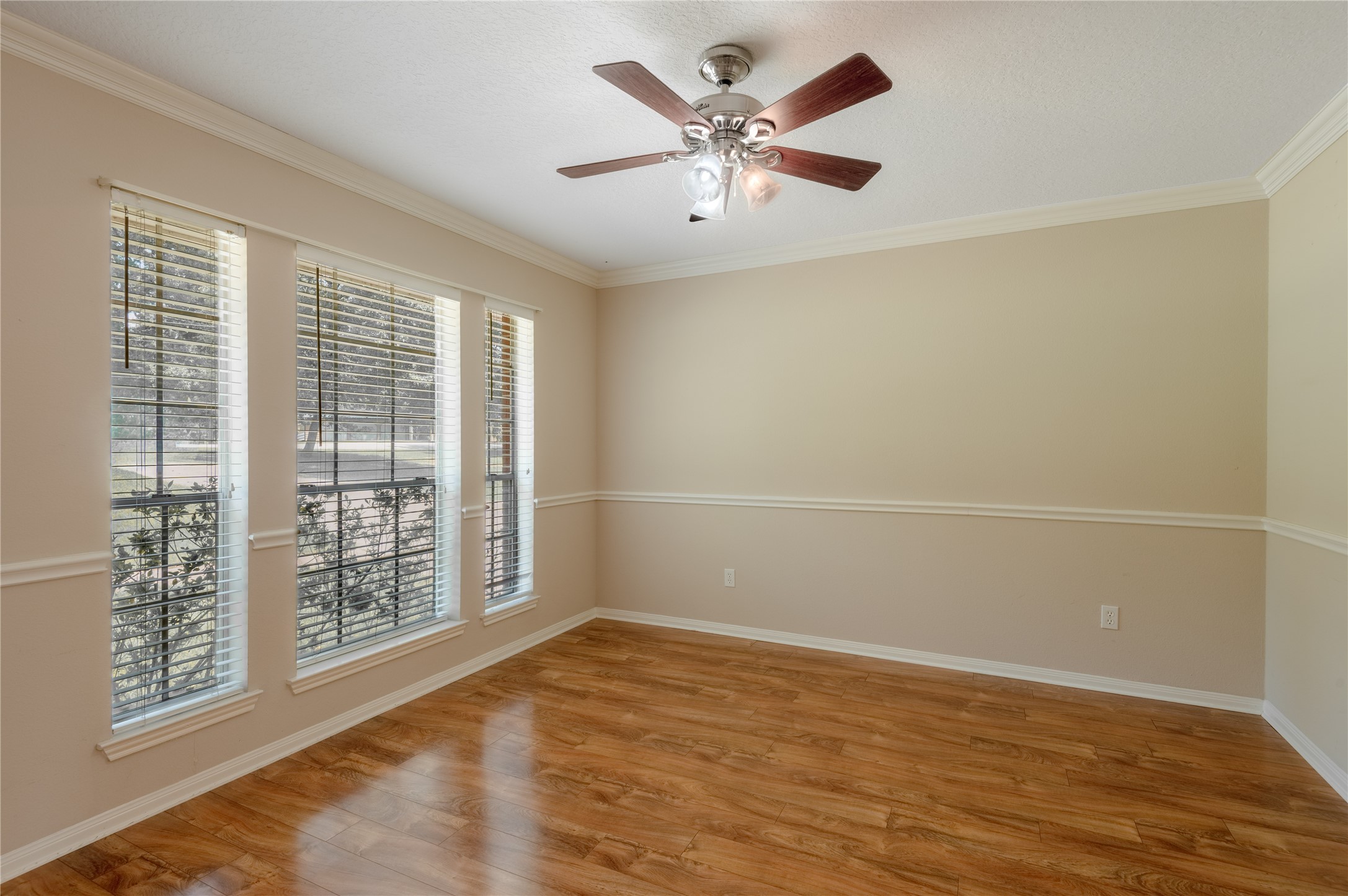 324 Red Oak Lane Trinity, TX 75862 - Photo 12 of 49 an empty room with wooden floor and windows