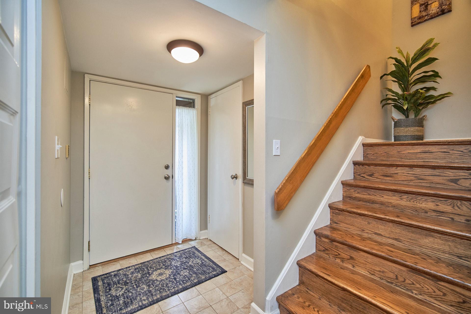 Front Foyer with closet and 1/2 bath
