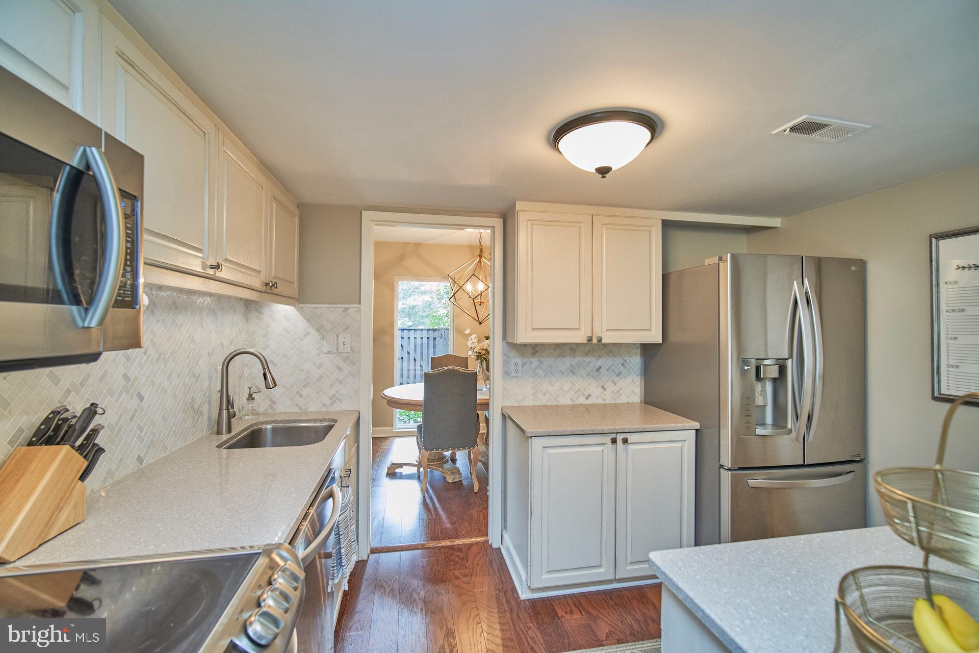 1813 Ivy Oak Square Reston, VA 20190 - Photo 9 of 28 Remodeled kitchen showing vie to dining room
