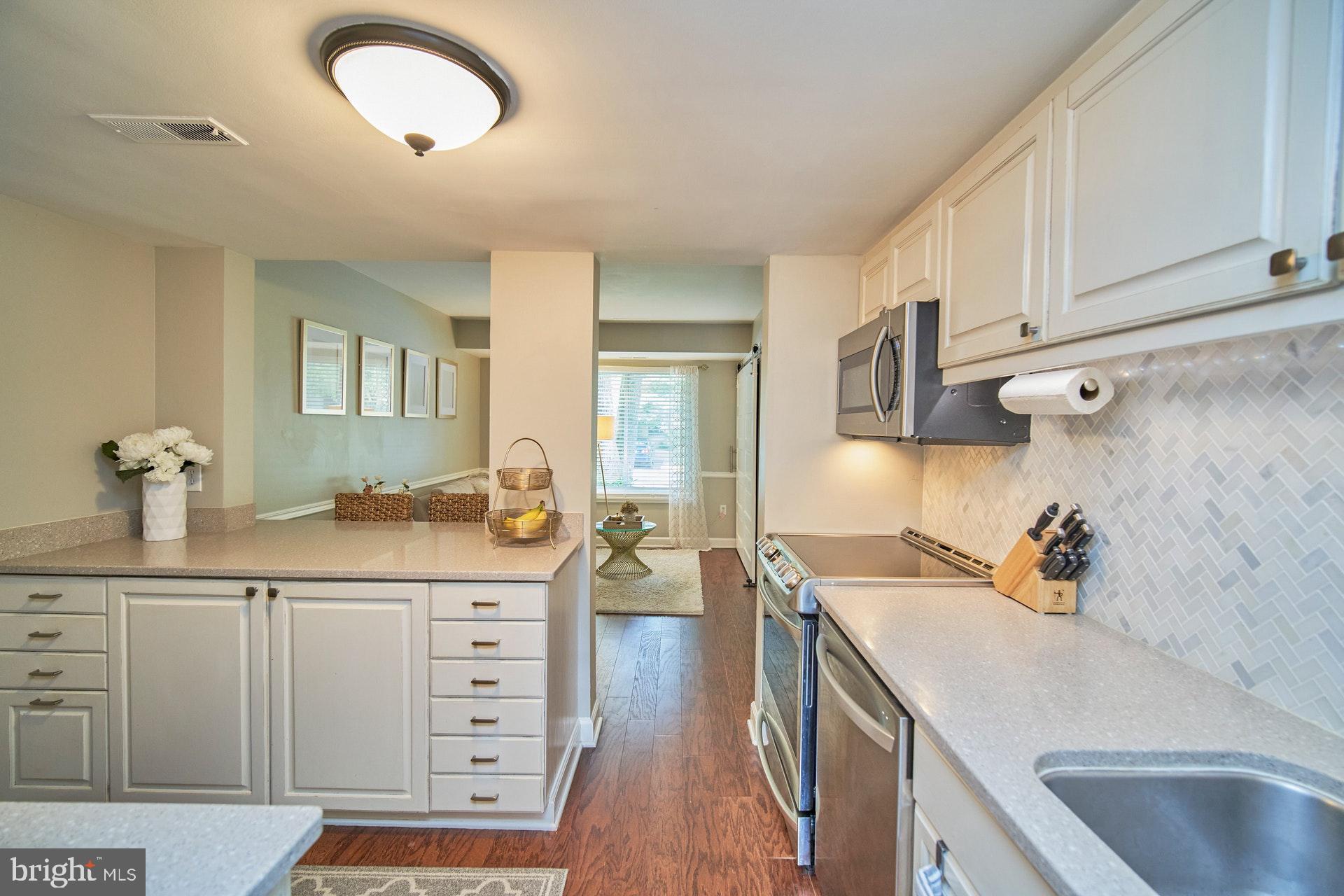 1813 Ivy Oak Square Reston, VA 20190 - Photo 10 of 28 Remodeled kitchen showing view to sitting area