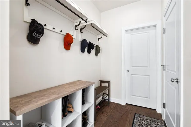 a view of a room that has a table and a chair