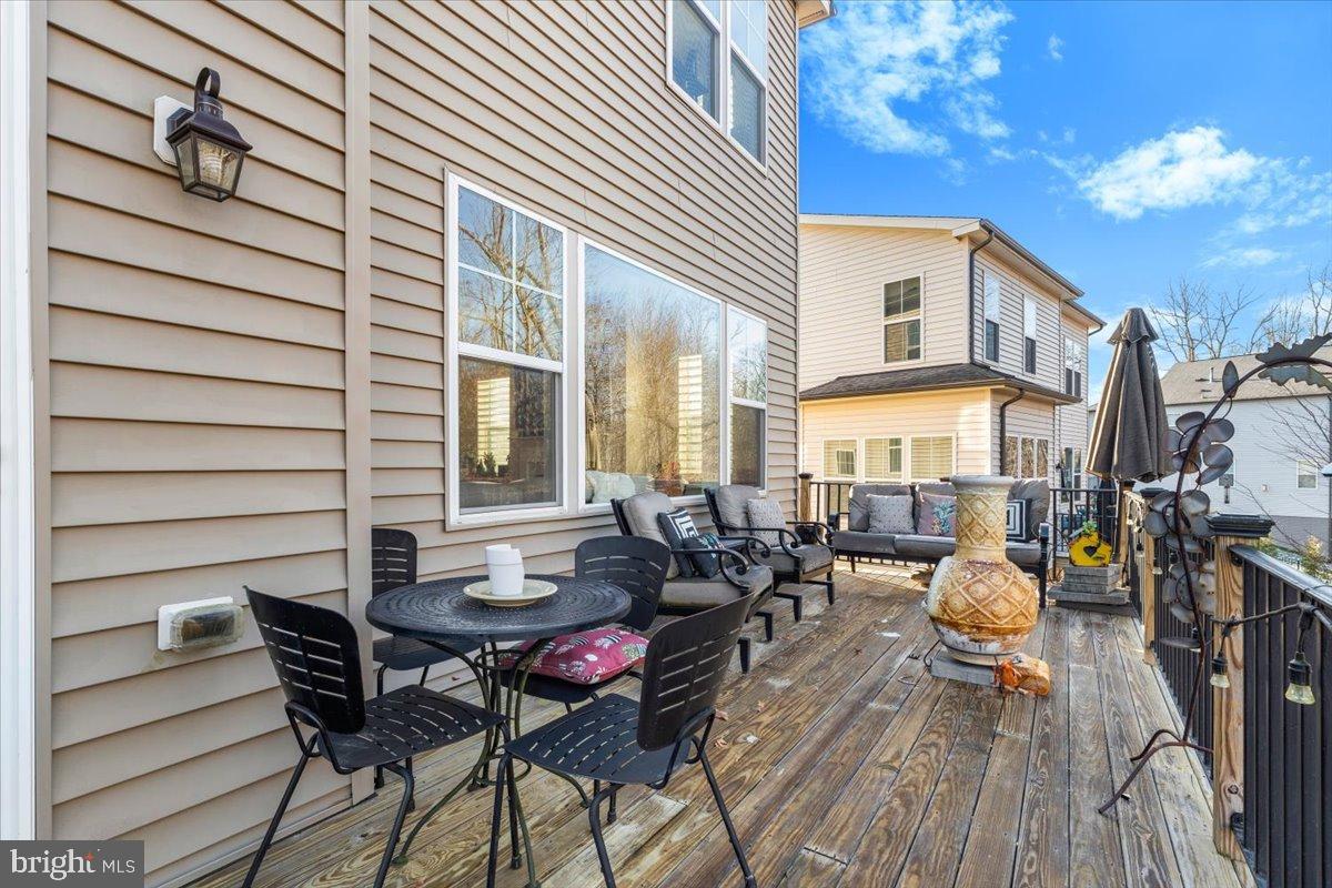 6828 West Shavano Road New Market, MD 21774 - Photo 18 of 58 an outdoor space with patio furniture and potted plants