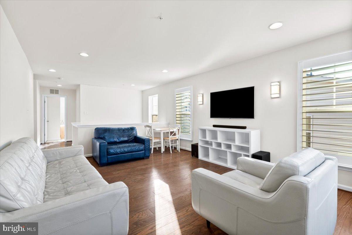 6828 West Shavano Road New Market, MD 21774 - Photo 22 of 58 a living room with furniture and a flat screen tv