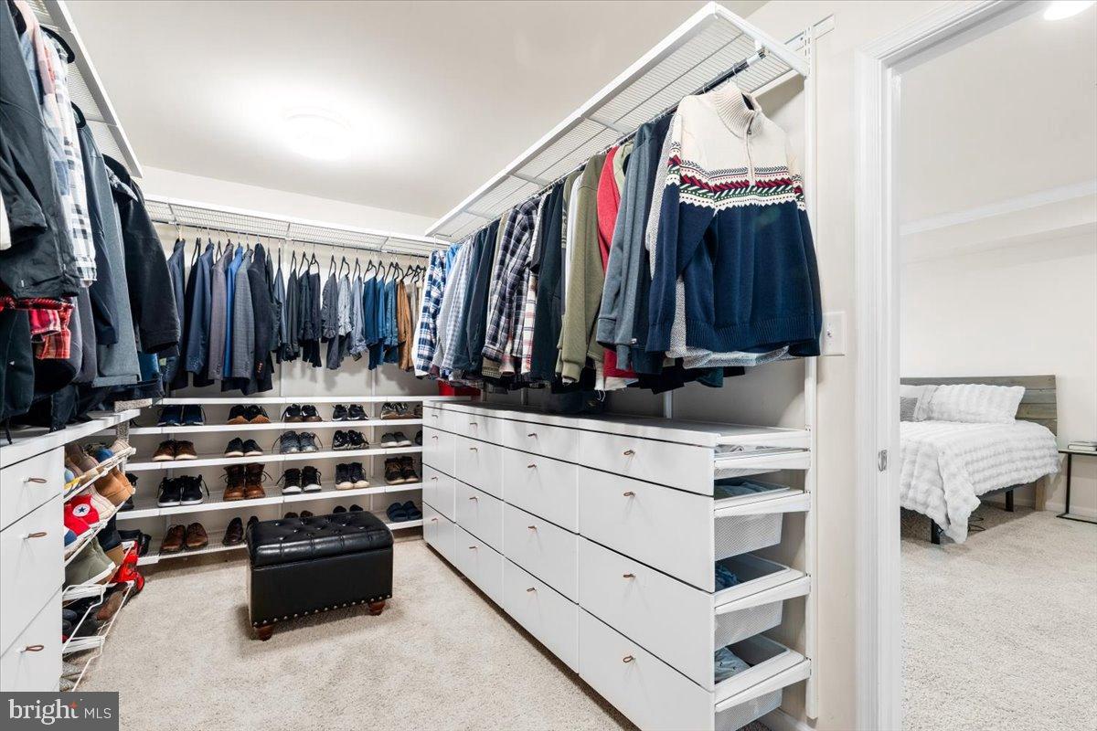 6828 West Shavano Road New Market, MD 21774 - Photo 28 of 58 a view of walk in closet with clothes and shoes