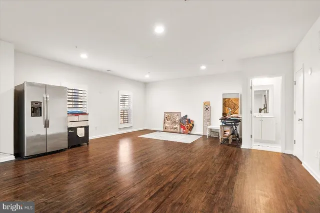 a view of a livingroom with furniture and a window