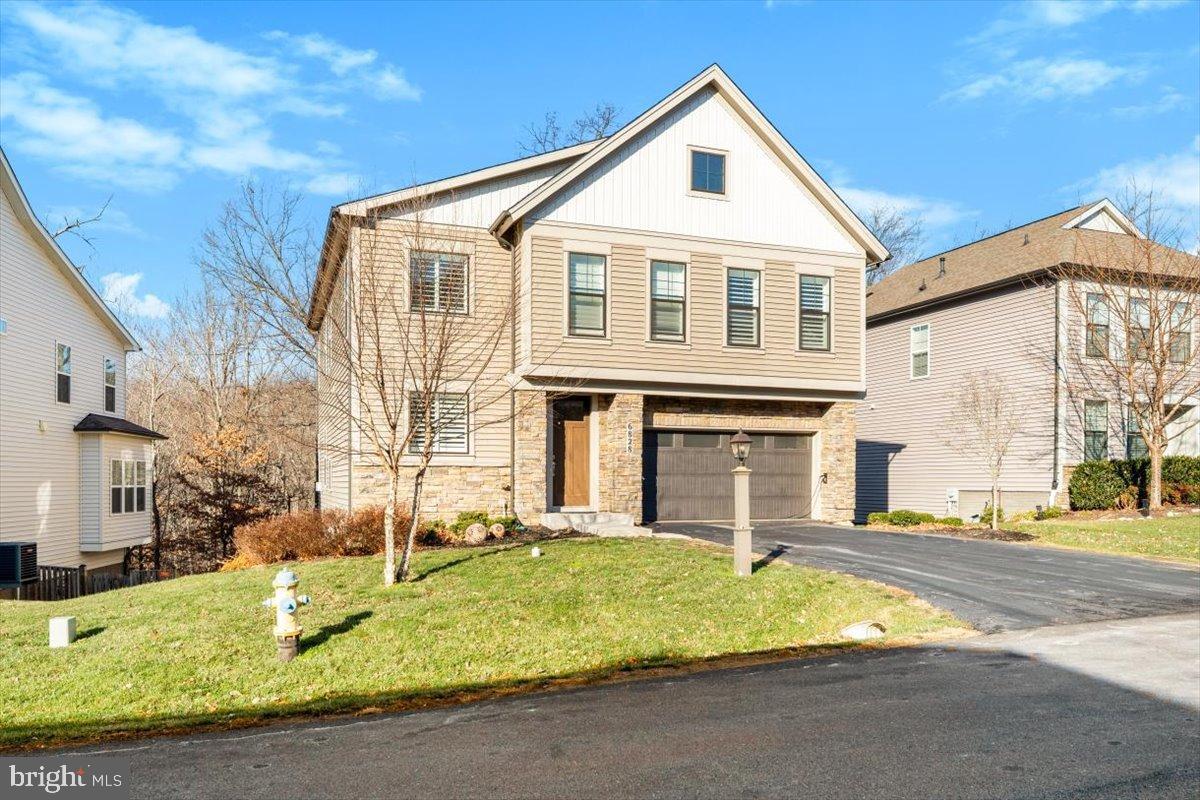 6828 West Shavano Road New Market, MD 21774 - Photo 55 of 58 a front view of a house with a yard