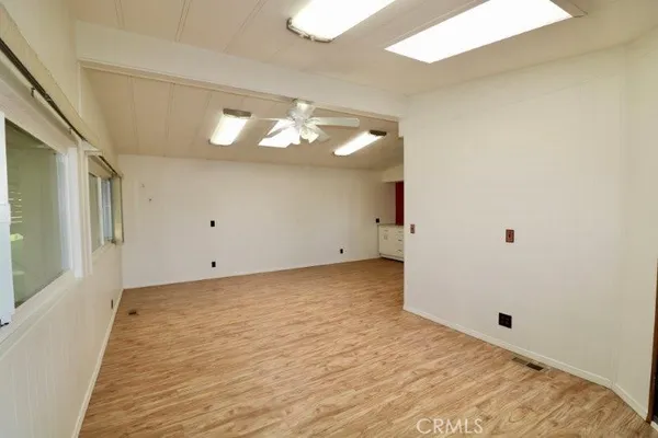 a view of a big room with closet and wooden floor