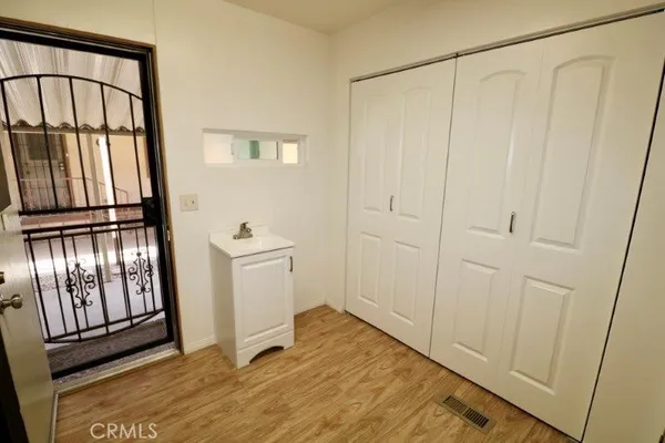 a view of an entryway with wooden floor