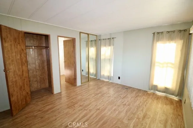 a bathroom with a tub sink a shower and a mirror