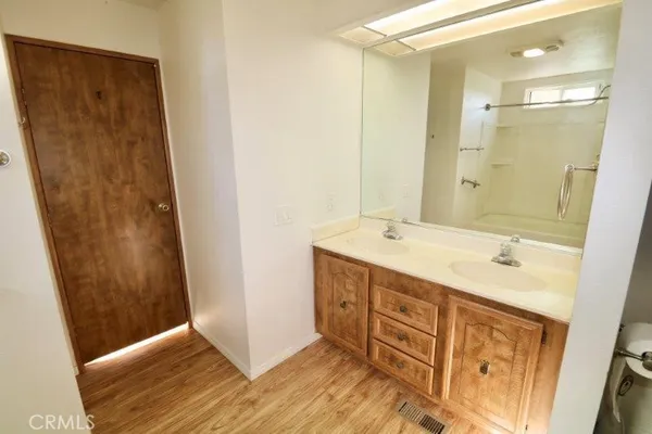 a bathroom with a bathtub and a shower
