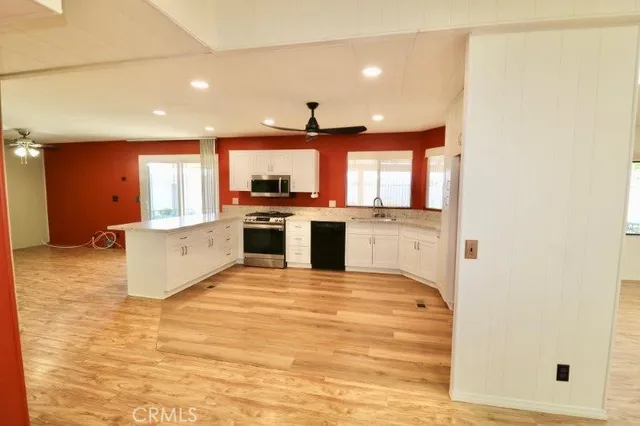 a view of a kitchen with a stove cabinets and a refrigerator