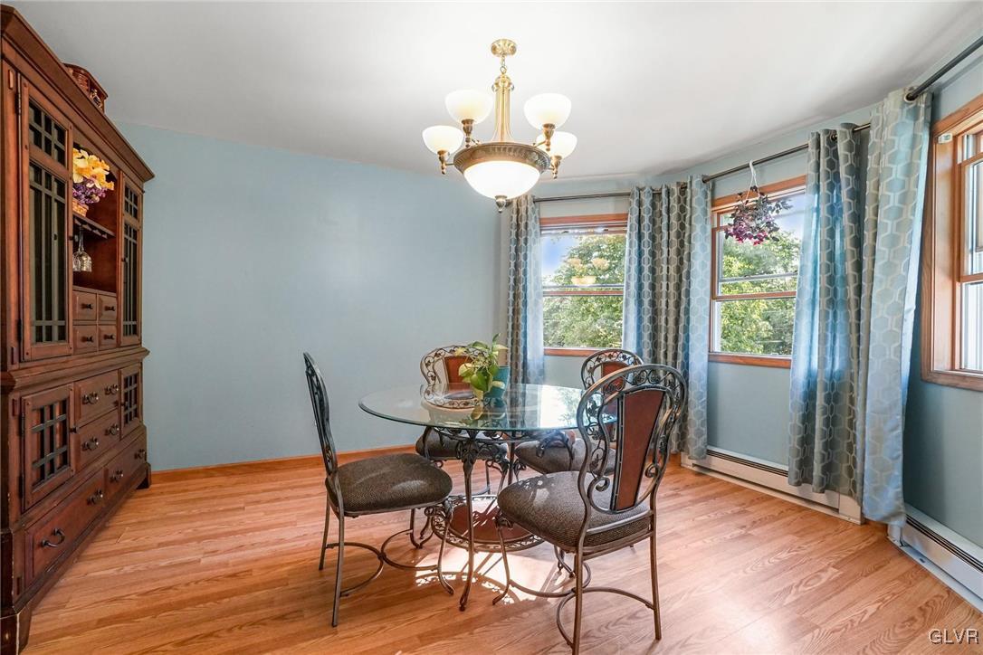 117 Mt Snow Road Henryville, PA 18332 - Photo 12 of 34 a view of a dining room with furniture wooden floor and chandelier