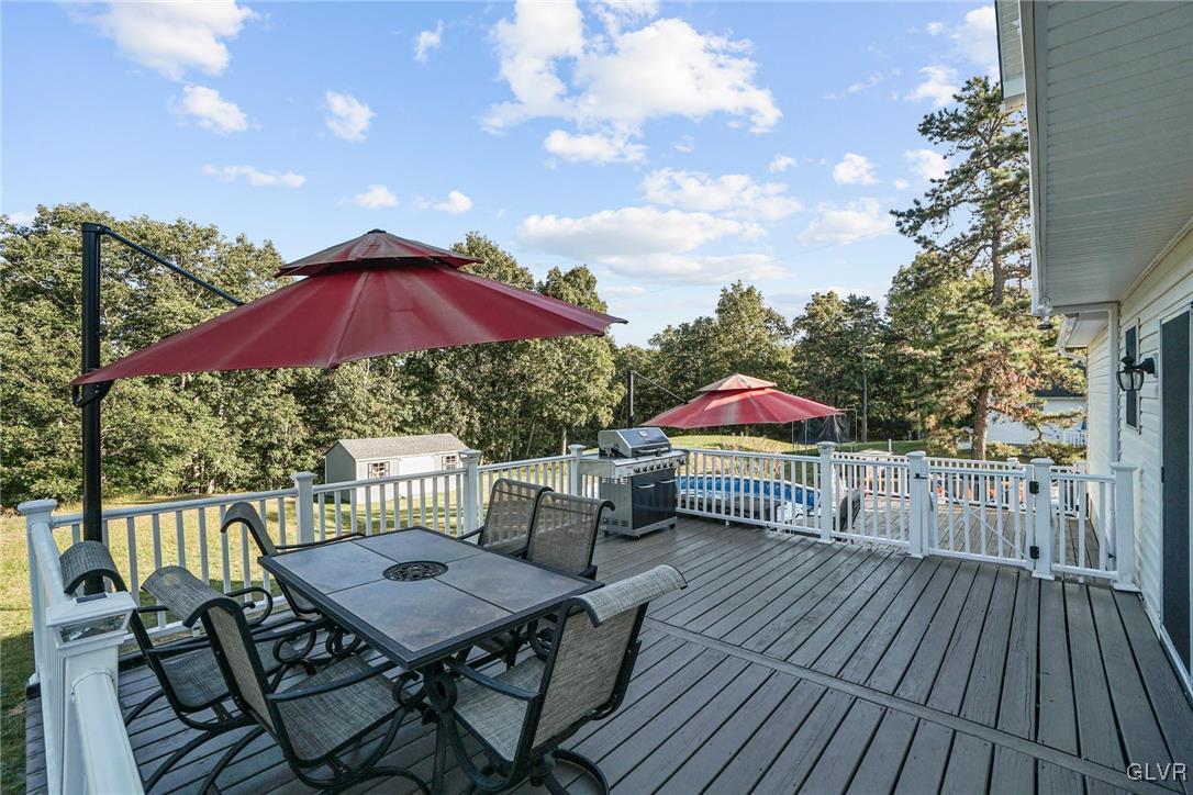 117 Mt Snow Road Henryville, PA 18332 - Photo 32 of 34 a view of a terrace with furniture and umbrella