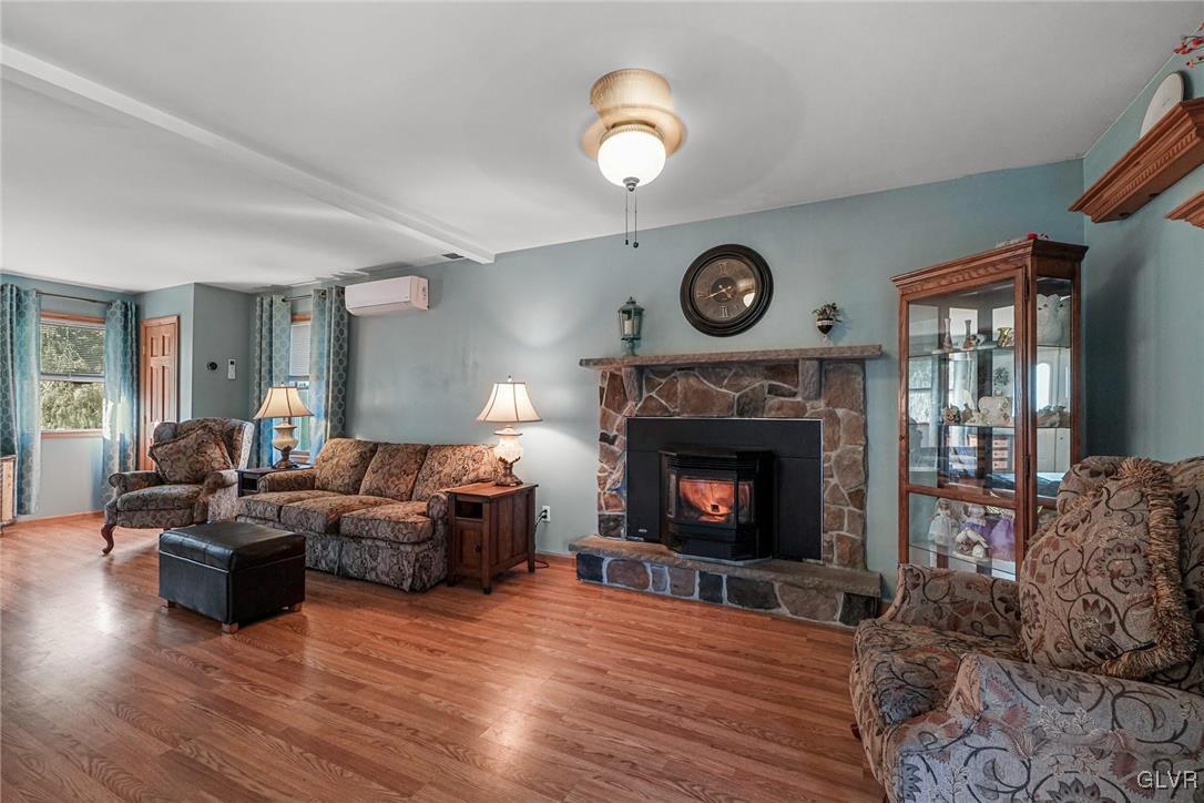 117 Mt Snow Road Henryville, PA 18332 - Photo 4 of 34 a living room with furniture and a fireplace