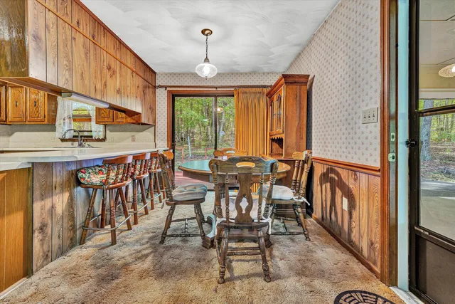 a view of a kitchen with a sink and cabinets