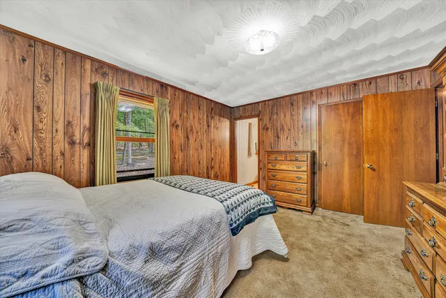 a bathroom with a sink a mirror and a shower