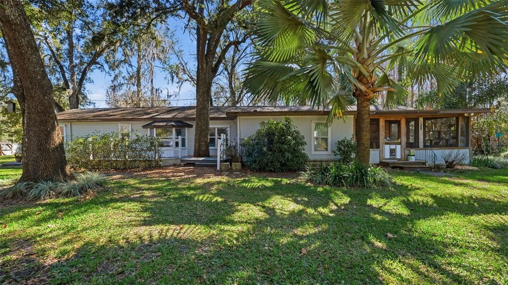 10565 Bessemer Street New Port Richey, FL 34654 - Photo 39 of 72 front view of a house with a big yard