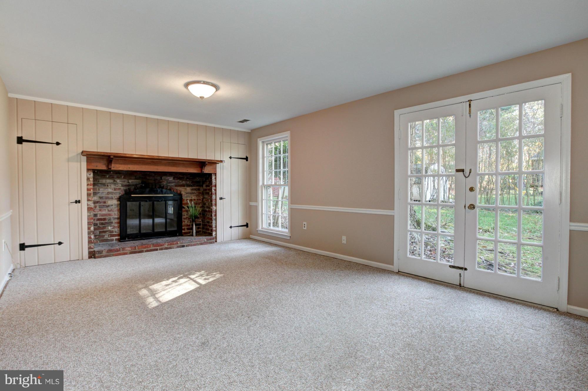 13224 Locksley Lane Silver Spring, MD 20904 - Photo 23 of 30 Rec Room with Brick Hearth Fireplace