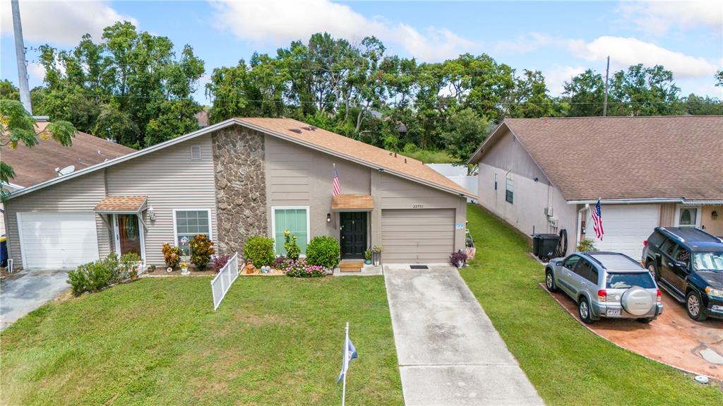 22751 Penny Loop Land O' Lakes, FL 34639 - Photo 24 of 27 a view of a yard in front of house