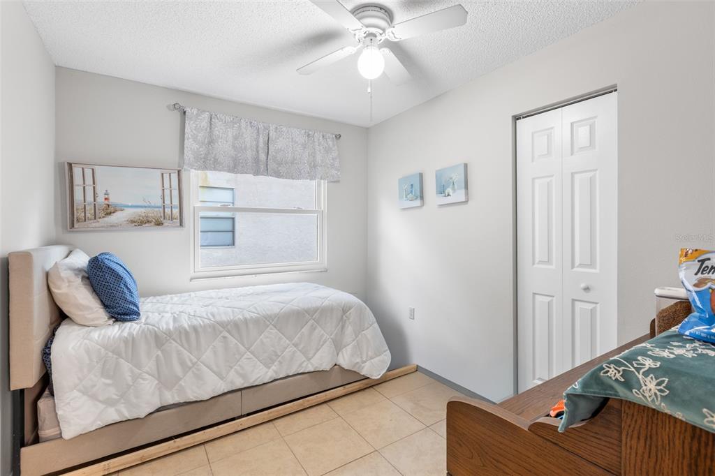 22751 Penny Loop Land O' Lakes, FL 34639 - Photo 9 of 27 a bedroom with a bed and window