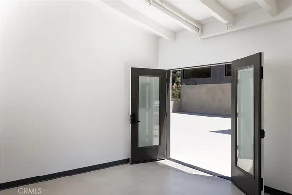 a kitchen with stainless steel appliances granite countertop a refrigerator and wooden cabinets